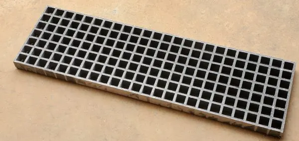 A close up of the bottom of a metal grate