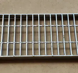 A metal grate sitting on top of a floor.