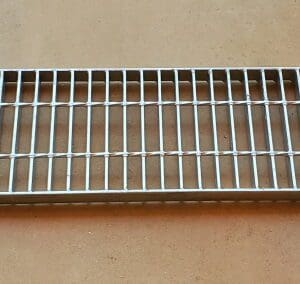 A metal grate sitting on top of a table.