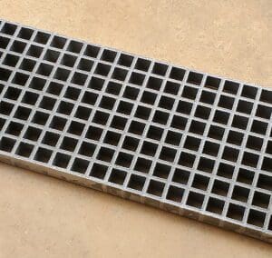 A close up of the bottom of a metal grate