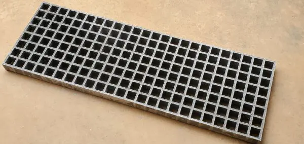 A close up of the bottom of a metal grate