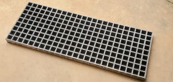 A close up of the bottom of a metal grate