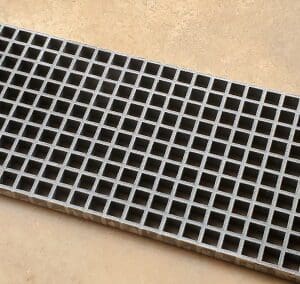 A close up of the bottom of a metal grate