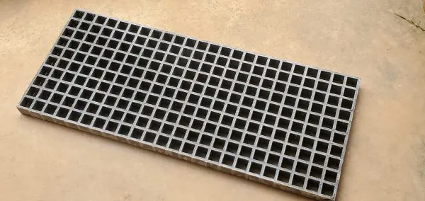 A close up of the bottom of a metal grate