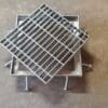 A metal grate sitting on top of a floor.