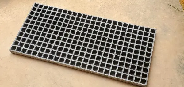 A close up of the bottom of a metal grate