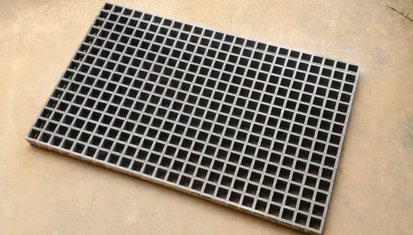 A close up of the bottom of a metal grate