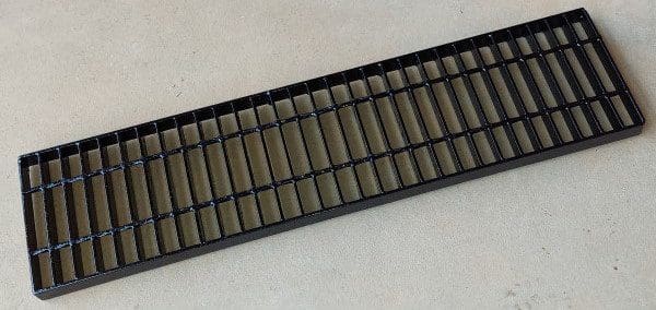 A black tray with many small bars on it