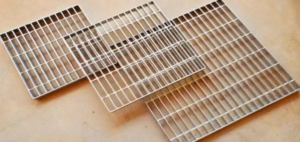 A close up of some metal grates on the floor