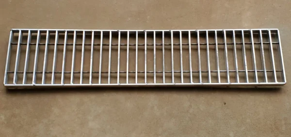 A metal grill is shown on the wall.