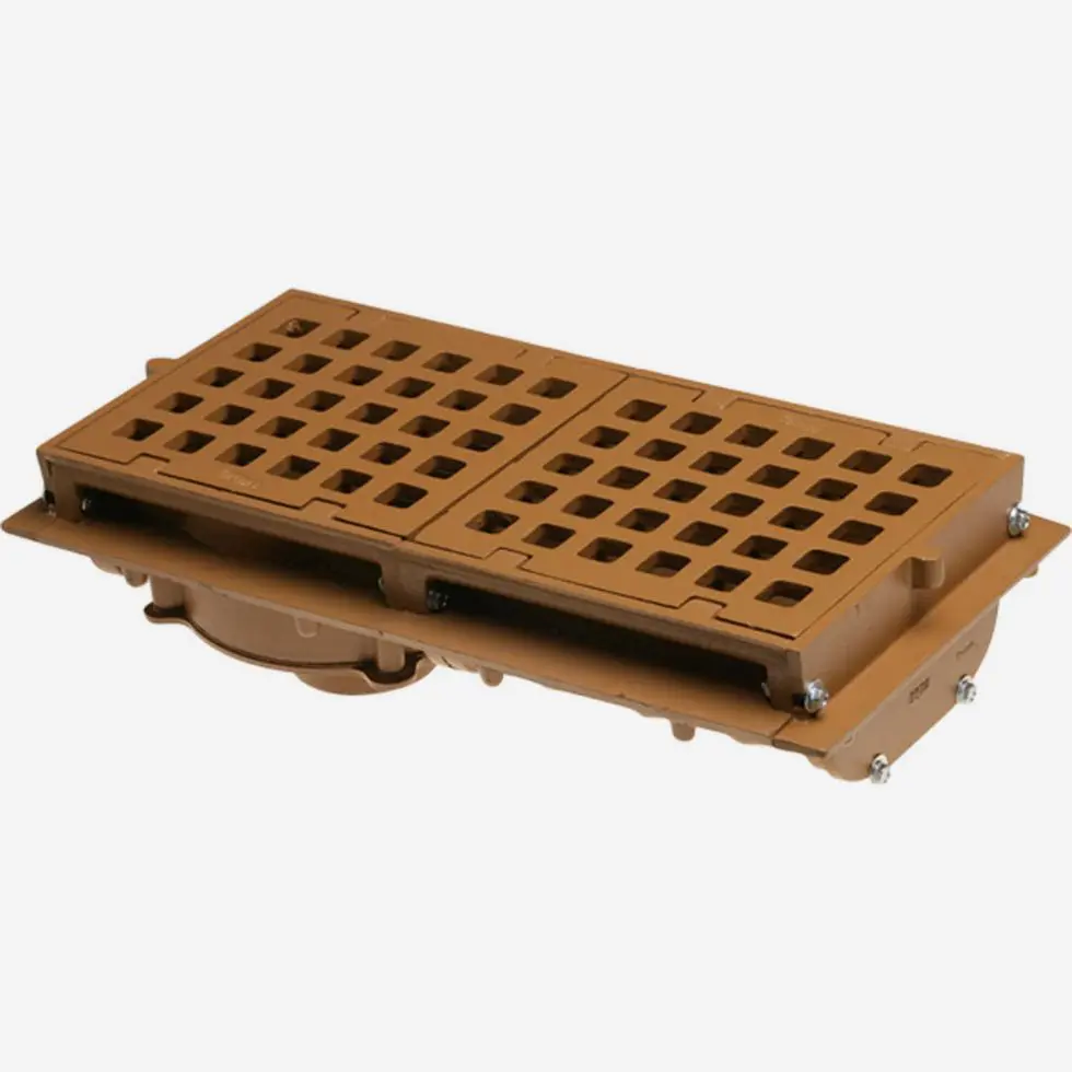 A brown plastic grate sitting on top of a wooden platform.