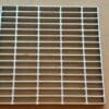 A metal grate sitting on top of a floor.