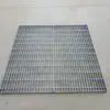 A metal grate sitting on top of the floor.