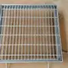A metal grate sitting on top of the ground.
