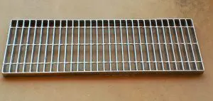 A metal grate sitting on top of a table.