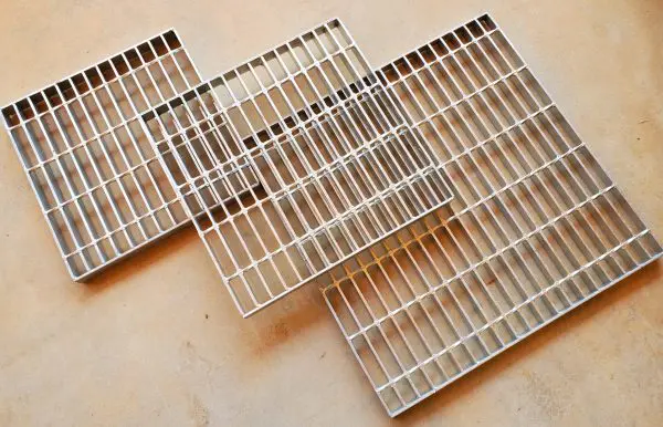 A close up of some metal grates on the floor