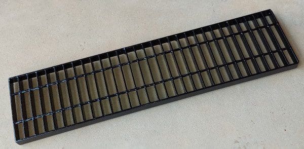 a black galvanized steel trench grate from The Trench Grate Store