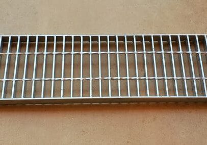 A metal grate sitting on top of a table.