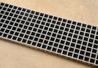 A close up of the bottom of a metal grate