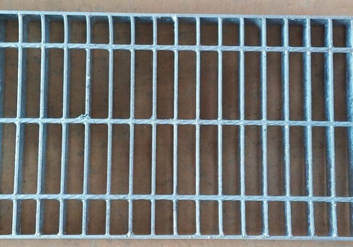 A close up of the bottom of a metal grate