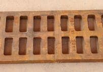 A wooden tray with 1 2 holes for the bottom.