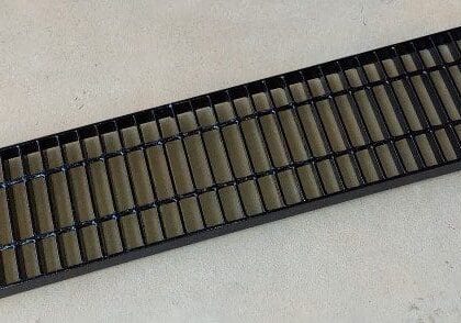 a black galvanized steel trench grate from The Trench Grate Store